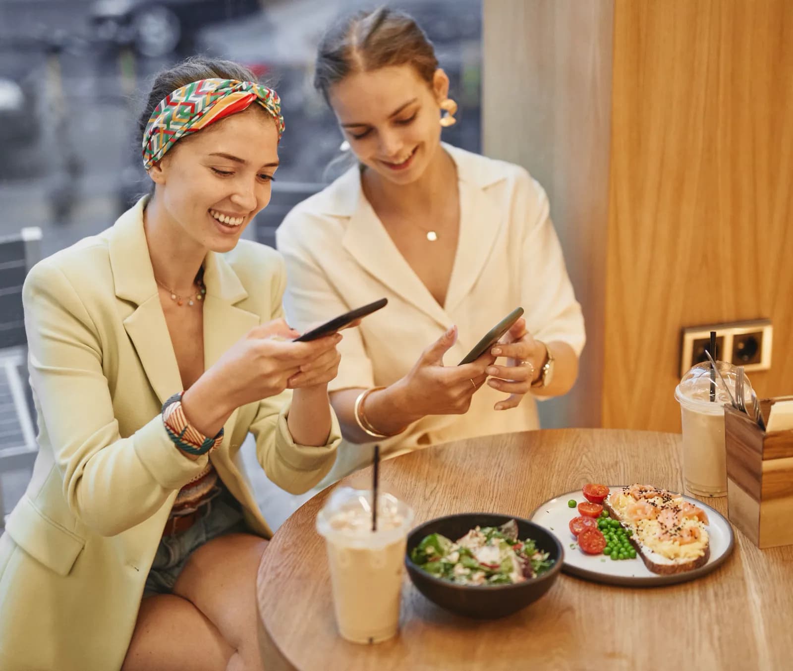 A young woman looking for a place to eat on her phone